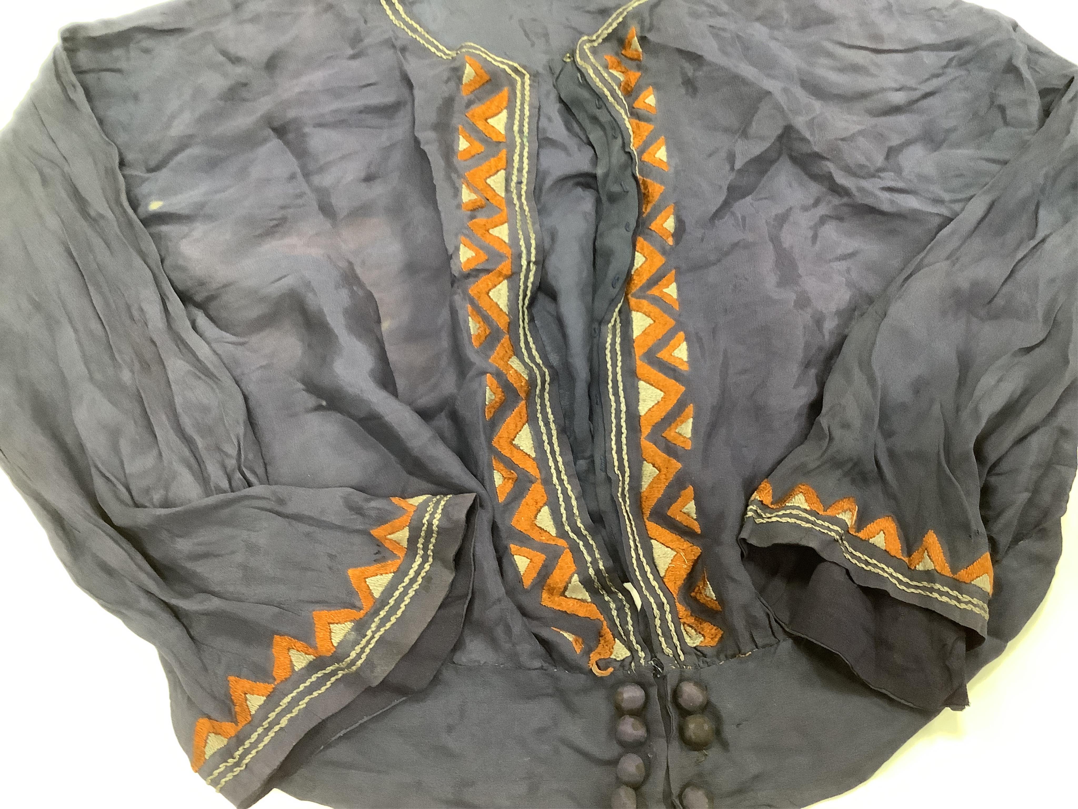 Two Edwardian blouses and three earlier lace camisoles, three black satin partly sewn skirts and later black velvet diamonte decorated evening coat. Condition - the coat, skirts and blouses need repair but are good for T